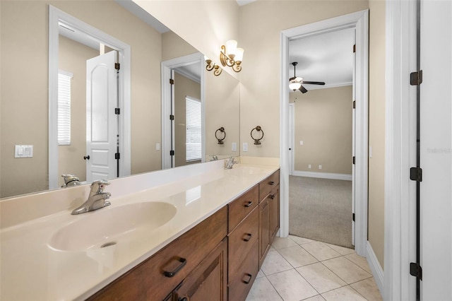 9933 Milano Dr, Trinity, FL 34655 - bathroom with a ceiling fan, tile patterned flooring, double vanity, and baseboards