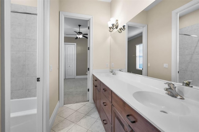 9933 Milano Dr, Trinity, FL 34655 - full bath with ceiling fan, tile patterned flooring, baseboards, double vanity, and bathtub / shower combination