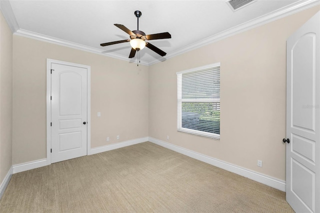 9933 Milano Dr, Trinity, FL 34655 - spare room featuring crown molding, ceiling fan, light carpet, and baseboards