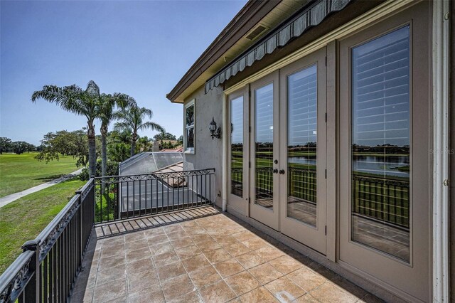 9933 Milano Dr, Trinity, FL 34655 - balcony featuring french doors and a water view