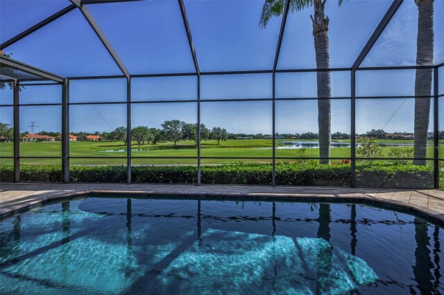 9933 Milano Dr, Trinity, FL 34655 - swimming pool featuring glass enclosure, golf course view, and a patio