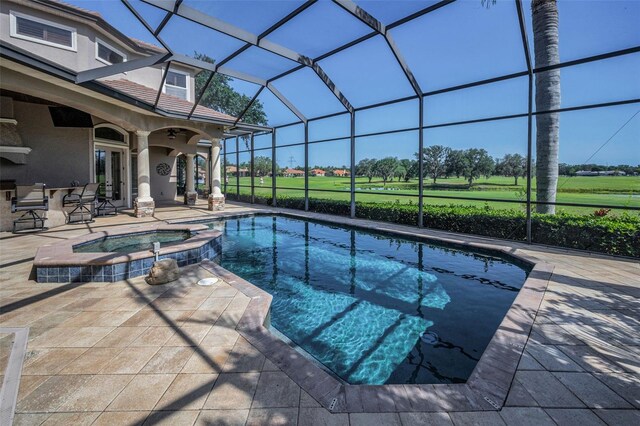 9933 Milano Dr, Trinity, FL 34655 - view of swimming pool featuring a patio area, glass enclosure, and a pool with connected hot tub