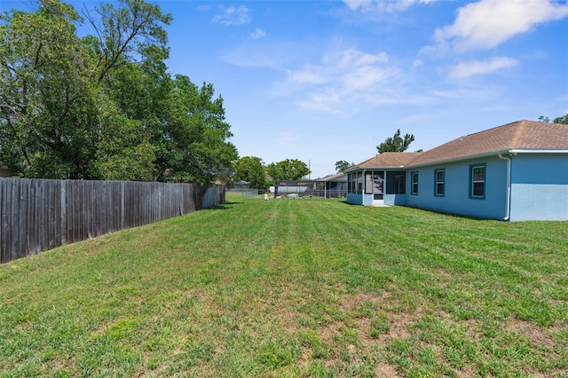view of yard with a sunroom