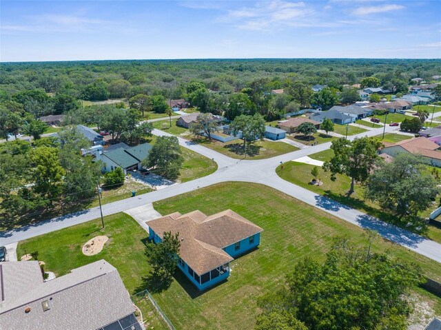 aerial view of residential area with a heavily wooded area