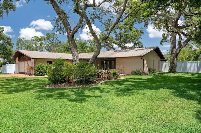 view of front of home with a garage and stucco siding