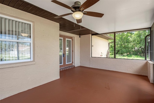 unfurnished sunroom featuring plenty of natural light and french doors