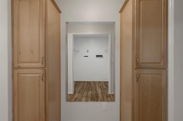 hall with wood finished floors