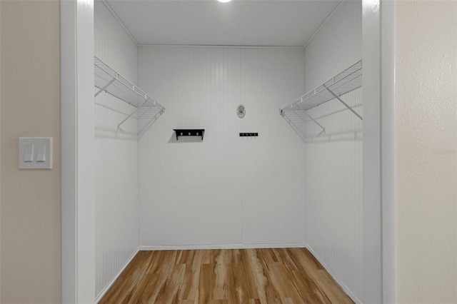 spacious closet featuring wood finished floors