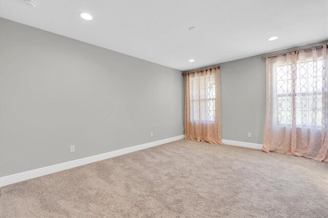 3767 Dragonfly Trl, Odessa, FL 33556 - empty room with light carpet, baseboards, and recessed lighting