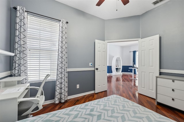 bedroom with wood finished floors, baseboards, and ceiling fan