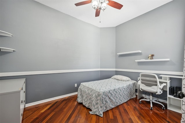bedroom featuring wood finished floors, ceiling fan, and baseboards