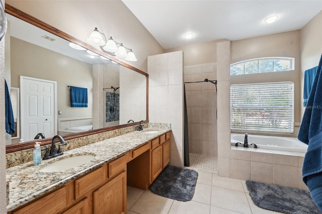 bathroom with tiled shower, tile patterned flooring, tiled bath, and double vanity