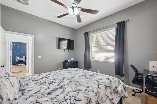 bedroom with ceiling fan and baseboards