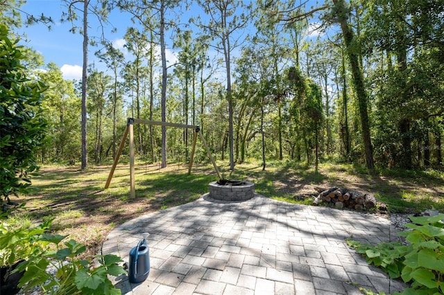 view of patio featuring a fire pit