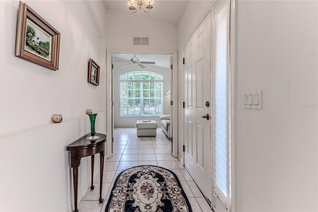 11158 Heathrow Ave, Spring Hill, FL 34609 - foyer entrance featuring light tile patterned flooring, lofted ceiling, ceiling fan, and a chandelier