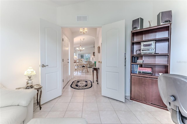 11158 Heathrow Ave, Spring Hill, FL 34609 - office space featuring a chandelier, light tile patterned flooring, and arched walkways