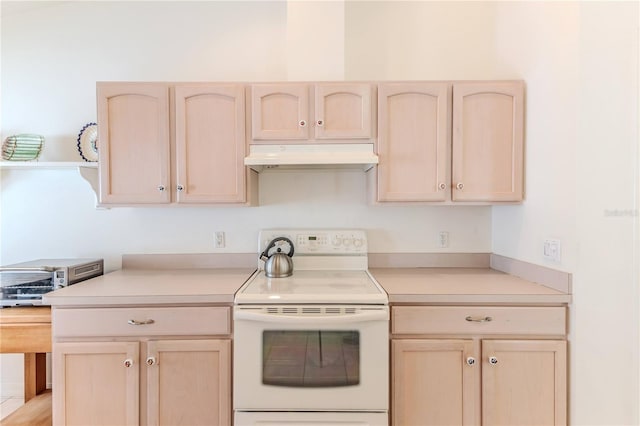 11158 Heathrow Ave, Spring Hill, FL 34609 - kitchen with electric range, light brown cabinetry, under cabinet range hood, and light countertops