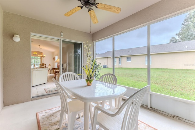 11158 Heathrow Ave, Spring Hill, FL 34609 - sunroom / solarium with a ceiling fan, outdoor dining area, and a chandelier