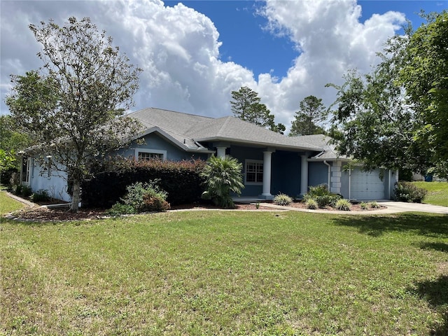 10054 Hernando Ridge Rd, Weeki Wachee, FL 34613 - view of front facade featuring a garage, a front yard, concrete driveway, and stucco siding