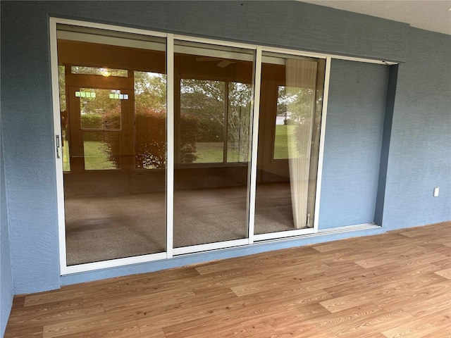 10054 Hernando Ridge Rd, Weeki Wachee, FL 34613 - doorway to outside featuring wood finished floors
