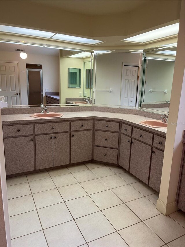 10054 Hernando Ridge Rd, Weeki Wachee, FL 34613 - bathroom featuring tile patterned floors and double vanity