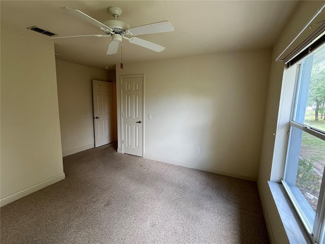 10054 Hernando Ridge Rd, Weeki Wachee, FL 34613 - unfurnished room featuring carpet flooring, baseboards, and ceiling fan