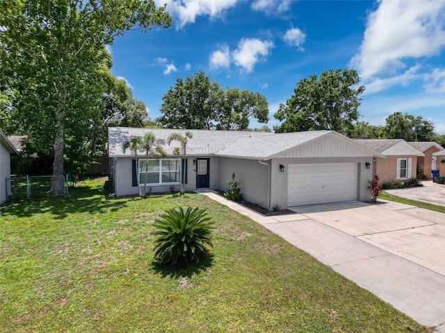 ranch-style home with an attached garage, concrete driveway, and stucco siding