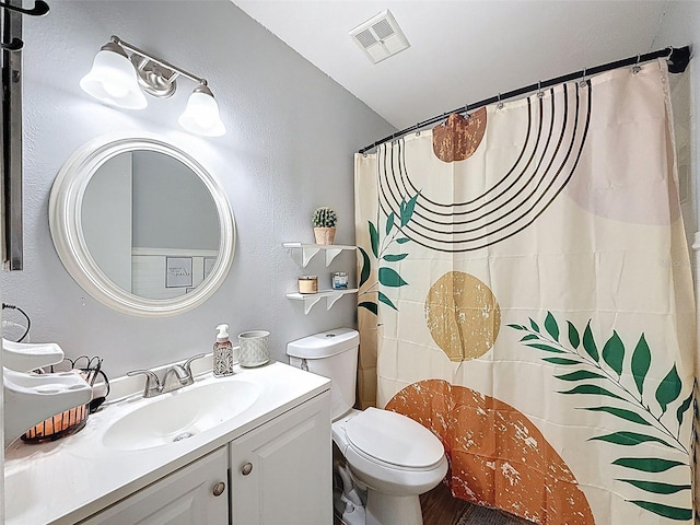 full bathroom with toilet, vanity, curtained shower, and wood finished floors
