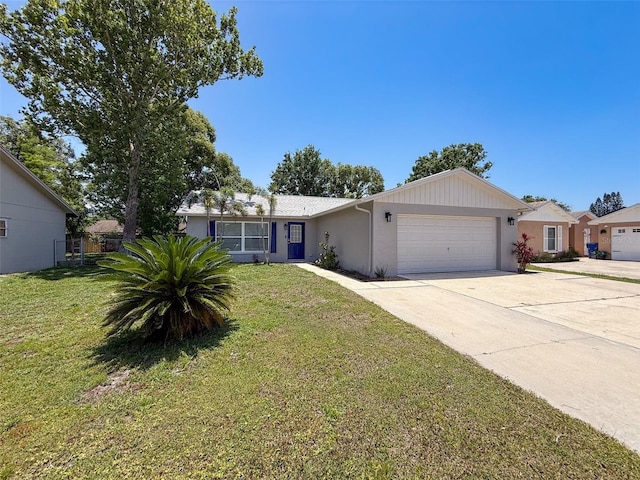 single story home with a garage, driveway, a front yard, and stucco siding