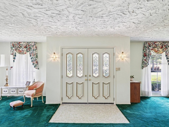6823 Oak Hill Dr, New Port Richey, FL 34653 - entrance foyer featuring dark colored carpet, plenty of natural light, and a textured ceiling