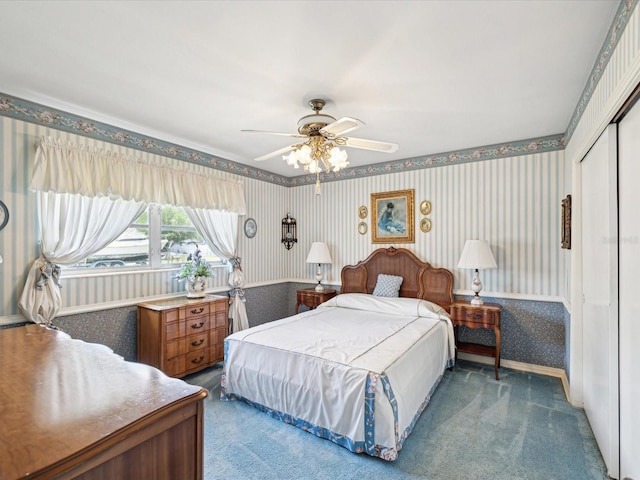 6823 Oak Hill Dr, New Port Richey, FL 34653 - carpeted bedroom with wallpapered walls, a closet, ceiling fan, and wainscoting