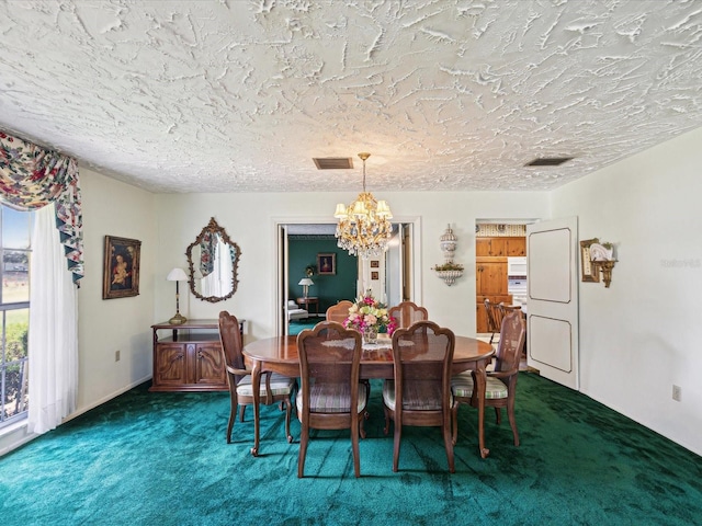 6823 Oak Hill Dr, New Port Richey, FL 34653 - dining space with a chandelier, carpet, and a textured ceiling
