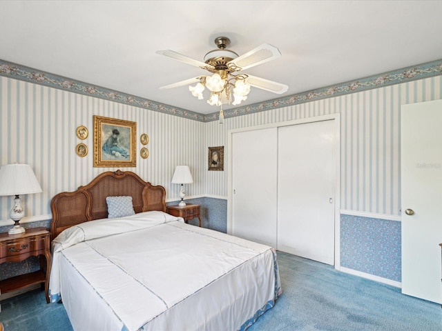 6823 Oak Hill Dr, New Port Richey, FL 34653 - bedroom featuring wallpapered walls, carpet, a closet, and ceiling fan