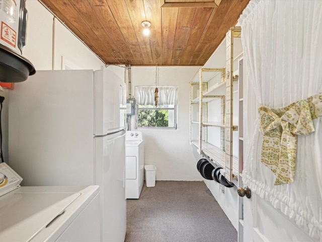 6823 Oak Hill Dr, New Port Richey, FL 34653 - laundry room featuring wood ceiling, carpet floors, and washer and dryer