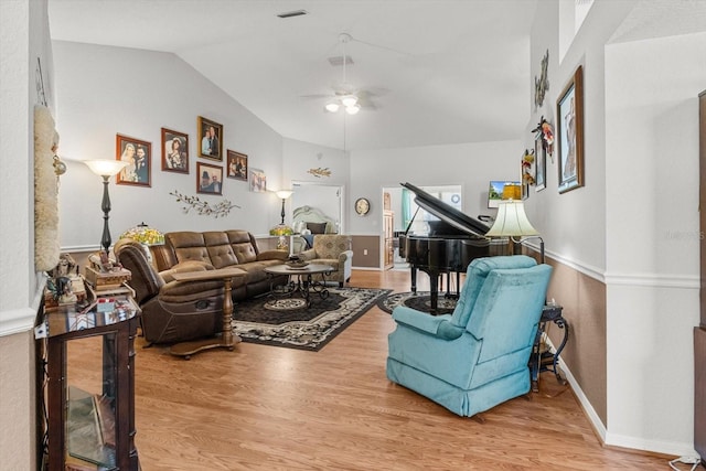 8596 SW 108th Place Rd, Ocala, FL 34481 - living area with lofted ceiling, a ceiling fan, wood finished floors, and baseboards