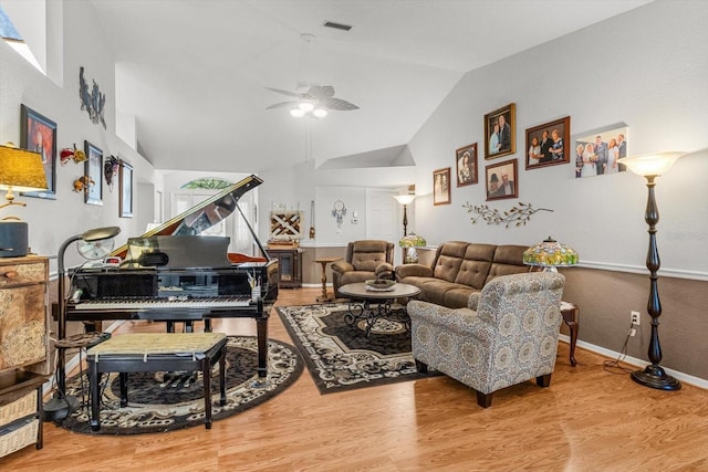 8596 SW 108th Place Rd, Ocala, FL 34481 - living area with lofted ceiling, wood finished floors, ceiling fan, and baseboards
