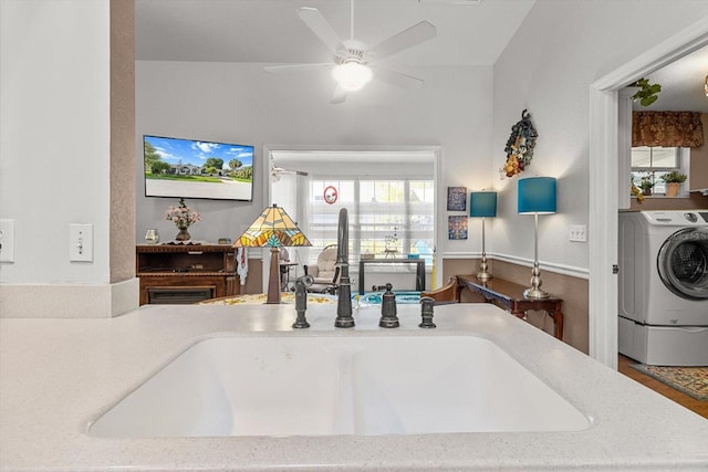 8596 SW 108th Place Rd, Ocala, FL 34481 - kitchen with washer / dryer, a sink, and ceiling fan