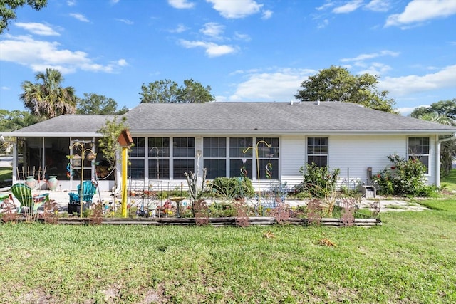 8596 SW 108th Place Rd, Ocala, FL 34481 - back of house with a sunroom and a lawn