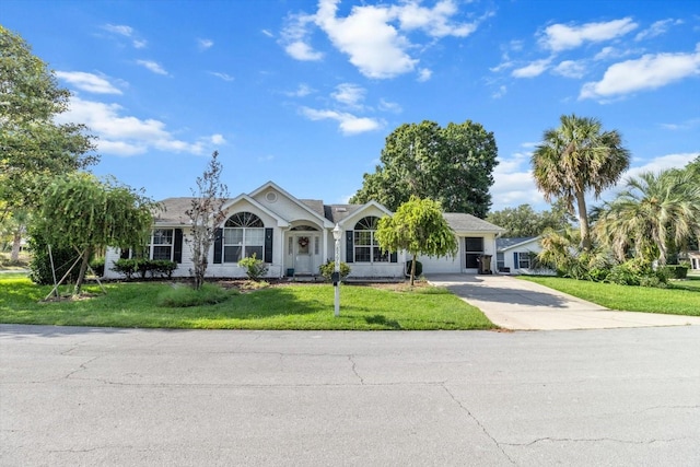 8596 SW 108th Place Rd, Ocala, FL 34481 - ranch-style house with a front lawn and driveway