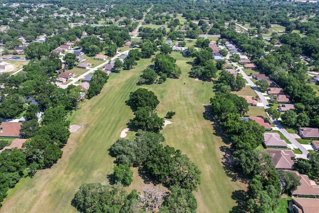 8596 SW 108th Place Rd, Ocala, FL 34481 - aerial overview of property's location featuring a local golf course, nearby suburban area, and a tree filled landscape