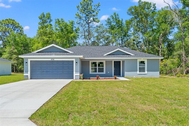 8792 N Sandree Dr, Dunnellon, FL 34434 - ranch-style house featuring an attached garage, concrete driveway, a front lawn, and stucco siding