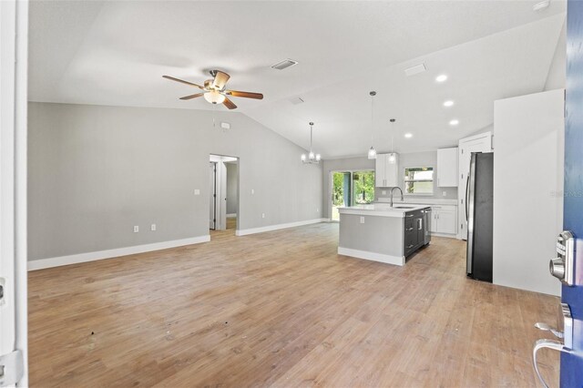 8792 N Sandree Dr, Dunnellon, FL 34434 - kitchen featuring open floor plan, freestanding refrigerator, ceiling fan, a sink, and lofted ceiling