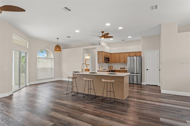 kitchen with stainless steel appliances, ceiling fan, light countertops, recessed lighting, and dark wood-style floors