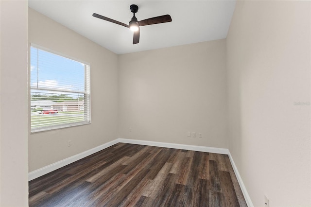 unfurnished room with dark wood-type flooring, baseboards, and ceiling fan