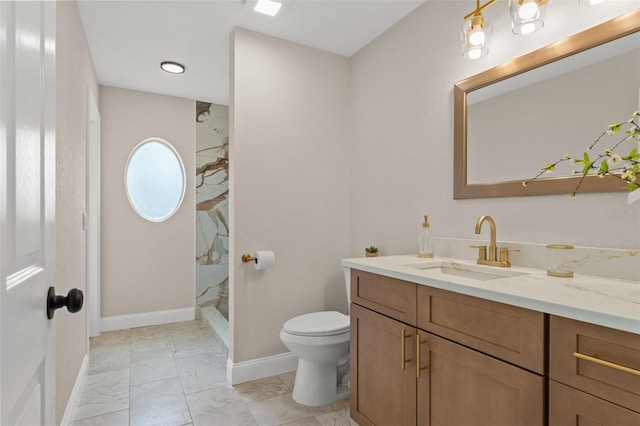 full bath with marble look tiles, toilet, vanity, walk in shower, and baseboards