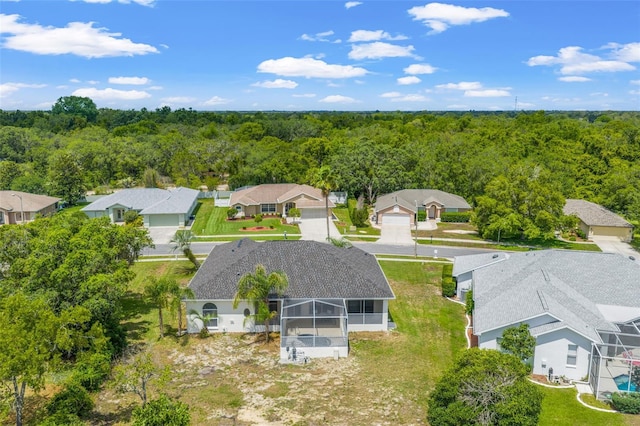 aerial perspective of suburban area with a heavily wooded area