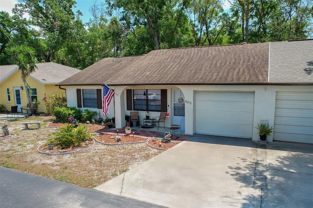 6213 Emerson Dr, New Port Richey, FL 34653 - single story home featuring roof with shingles, an attached garage, concrete driveway, stucco siding, and covered porch