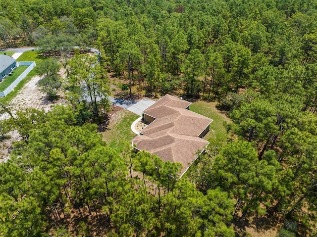 view from above of property featuring a forest