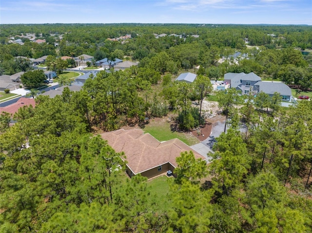 aerial perspective of suburban area with a forest