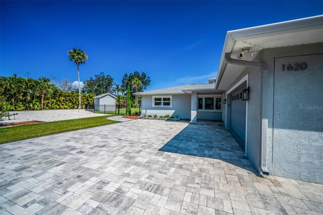 1620 Sea Breeze Dr, Tarpon Springs, FL 34689 - view of patio featuring decorative driveway